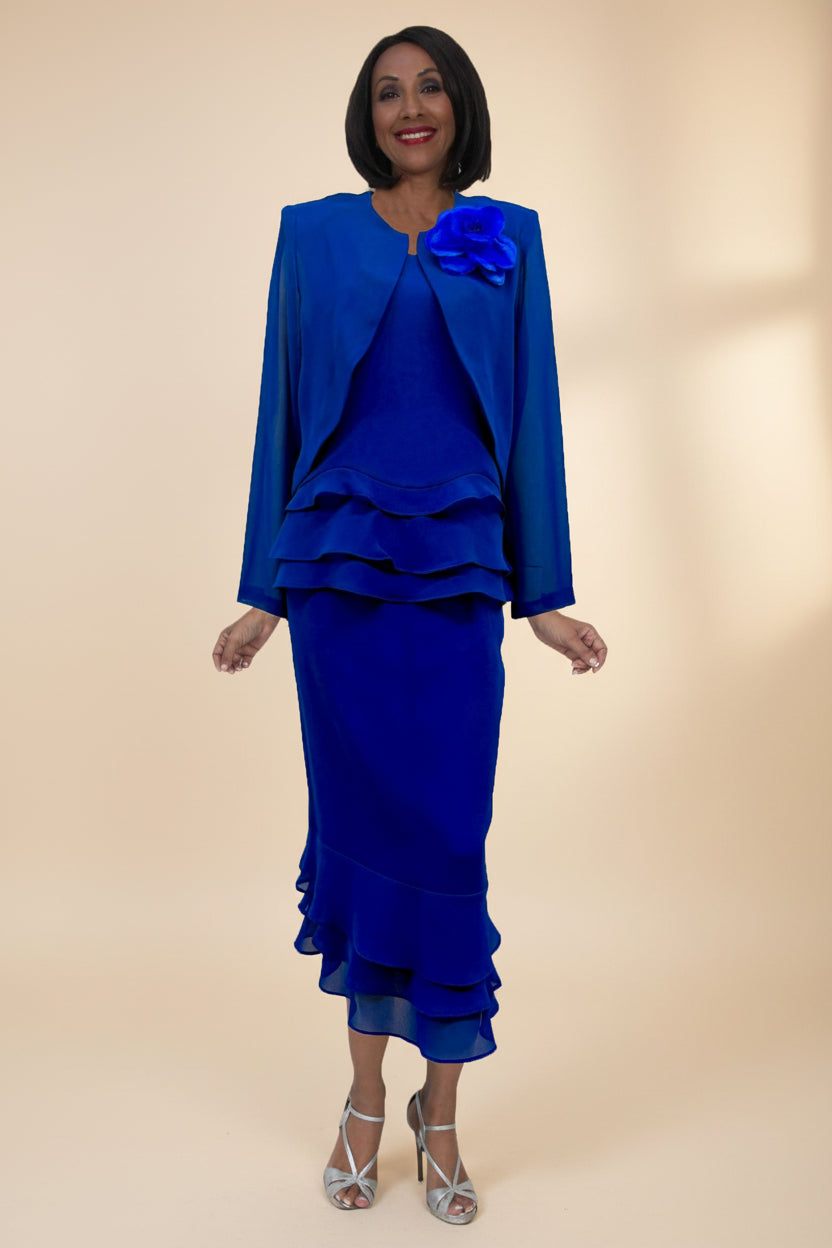 Woman wearing a blue dress with a matching jacket on a white background