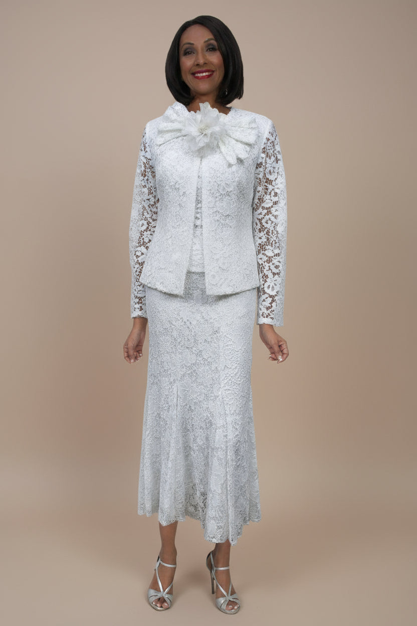 Woman wearing a white lace outfit with a large bow on a white background