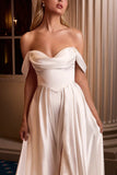 Woman wearing a white strapless gown in an elegant indoor setting